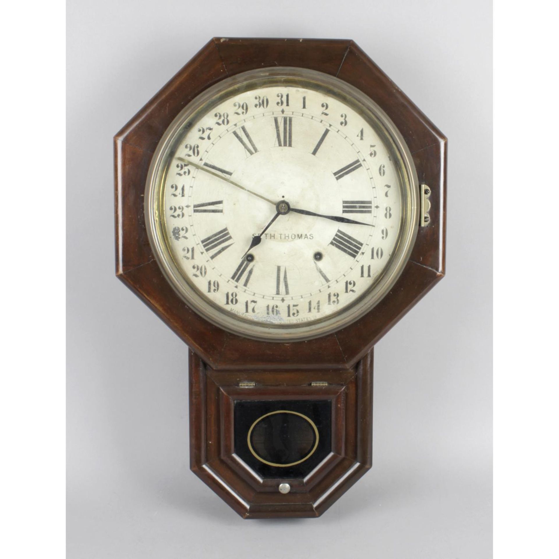 An early twentieth century American Seth Thomas drop dial wall clock.