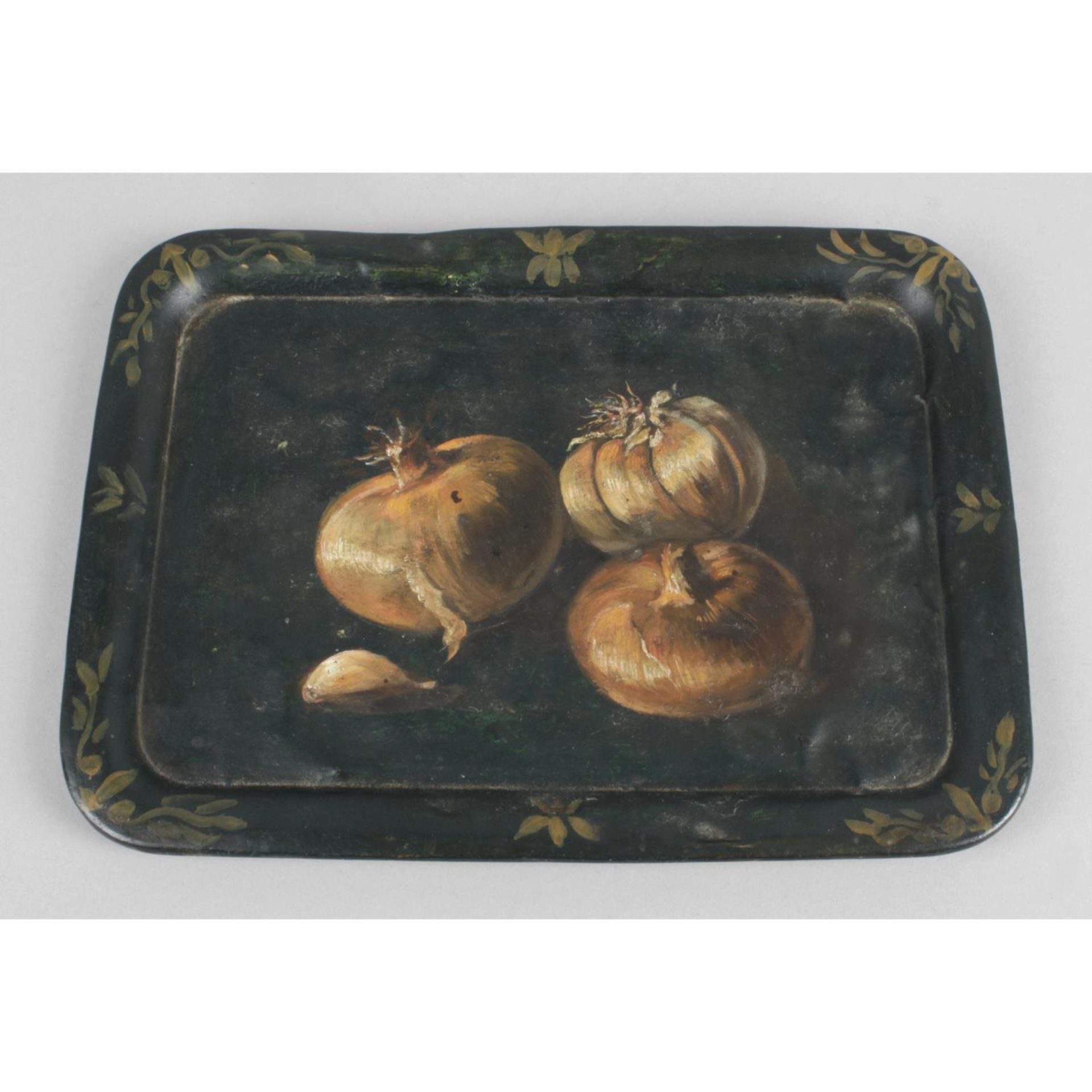 A late nineteenth century rectangular metal tray with raised border.