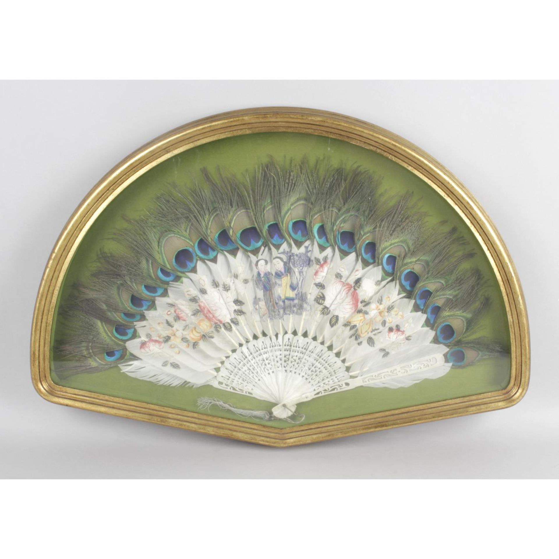 An early twentieth century ladies handheld folding fan , with carved and pierced ivory montures.