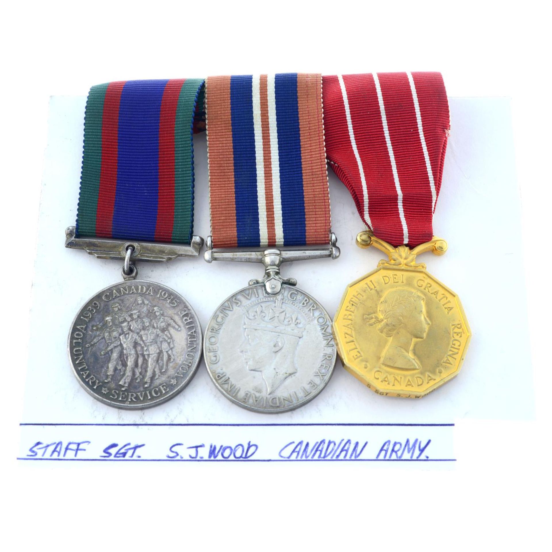 A group of three medals comprising Canadian Volunteer Service Medal,