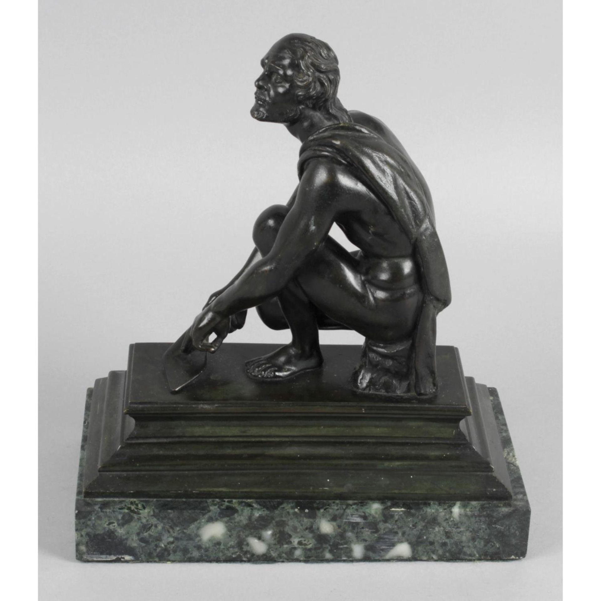 After Giovanni Battista Foggini, a bronze figure modelled as Arrotino.