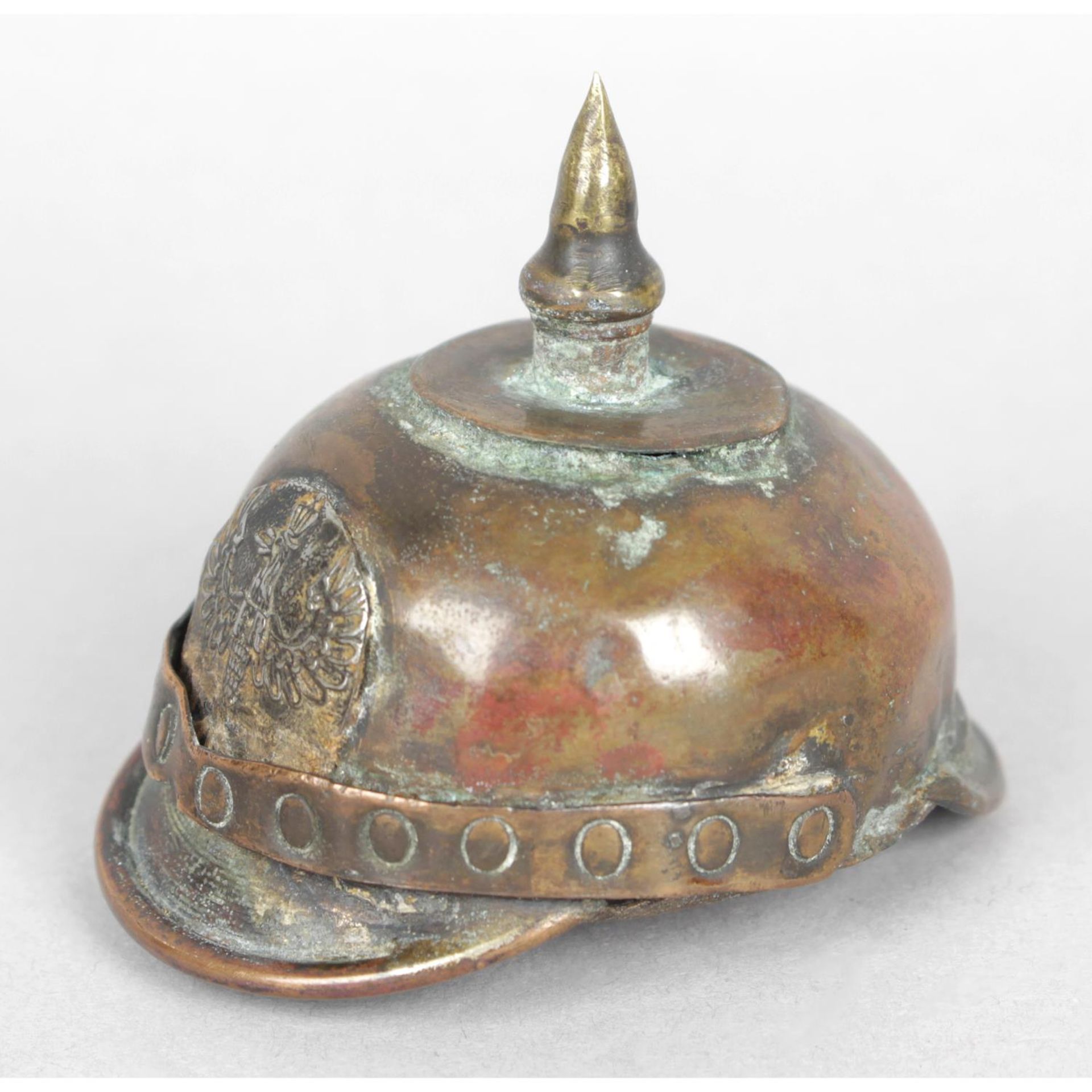 An amusing early twentieth century copper and brass snuff box modelled as a first world war German