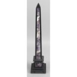 A black marble and amethyst desk ornament, modelled as an obelisk.