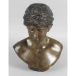 A cast bronze head and shoulder bust modelled a classical male.