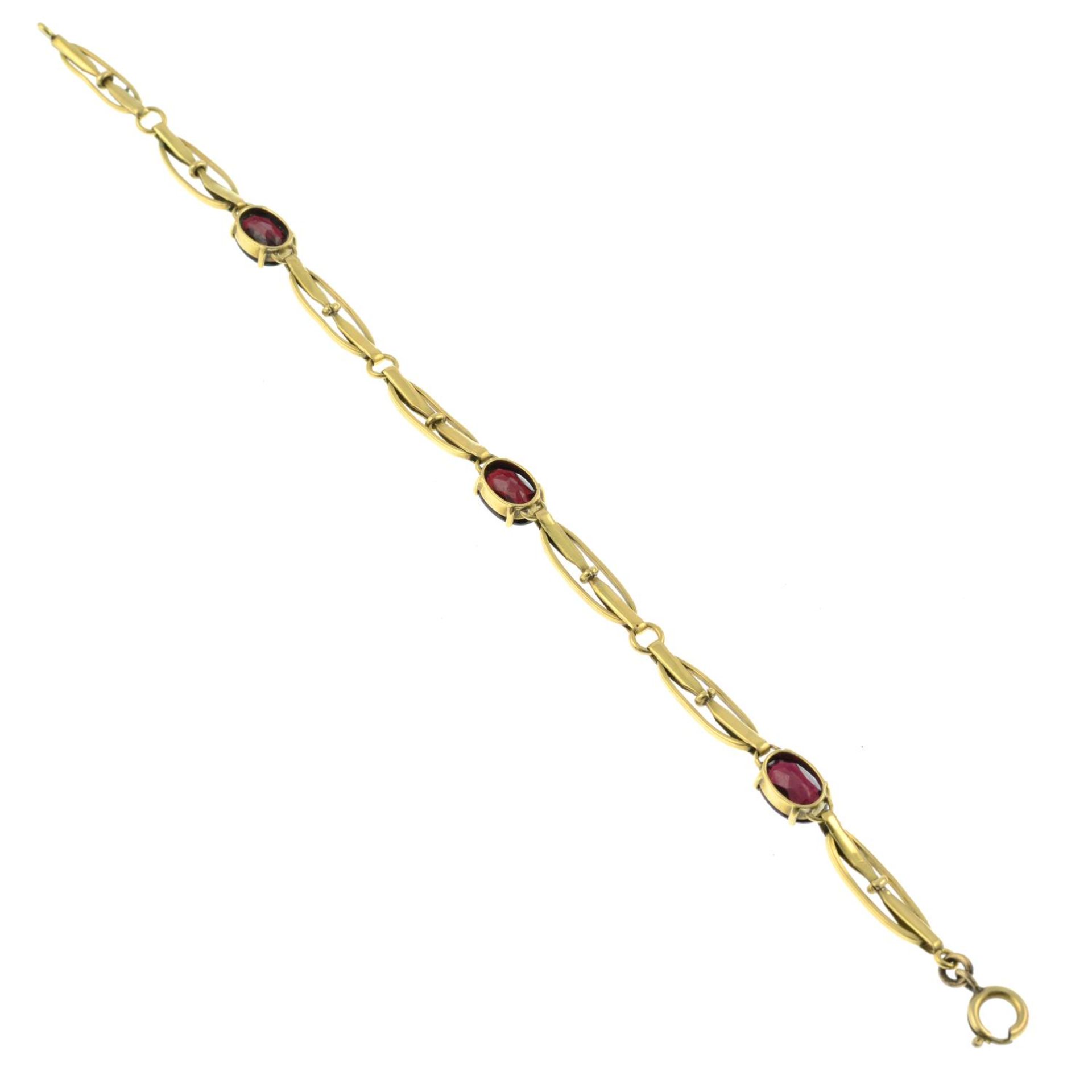 An early 20th century 9ct gold garnet and white enamel bracelet.Length 20cms. - Bild 3 aus 3