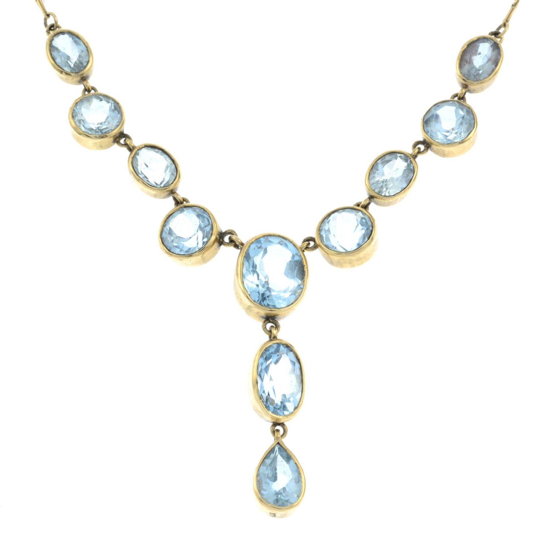 A 9ct gold blue topaz necklace.Hallmarks for Birmingham.Length 45cms.