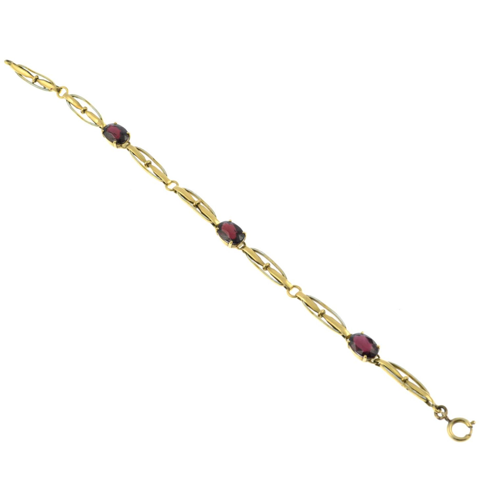 An early 20th century 9ct gold garnet and white enamel bracelet.Length 20cms. - Bild 2 aus 3