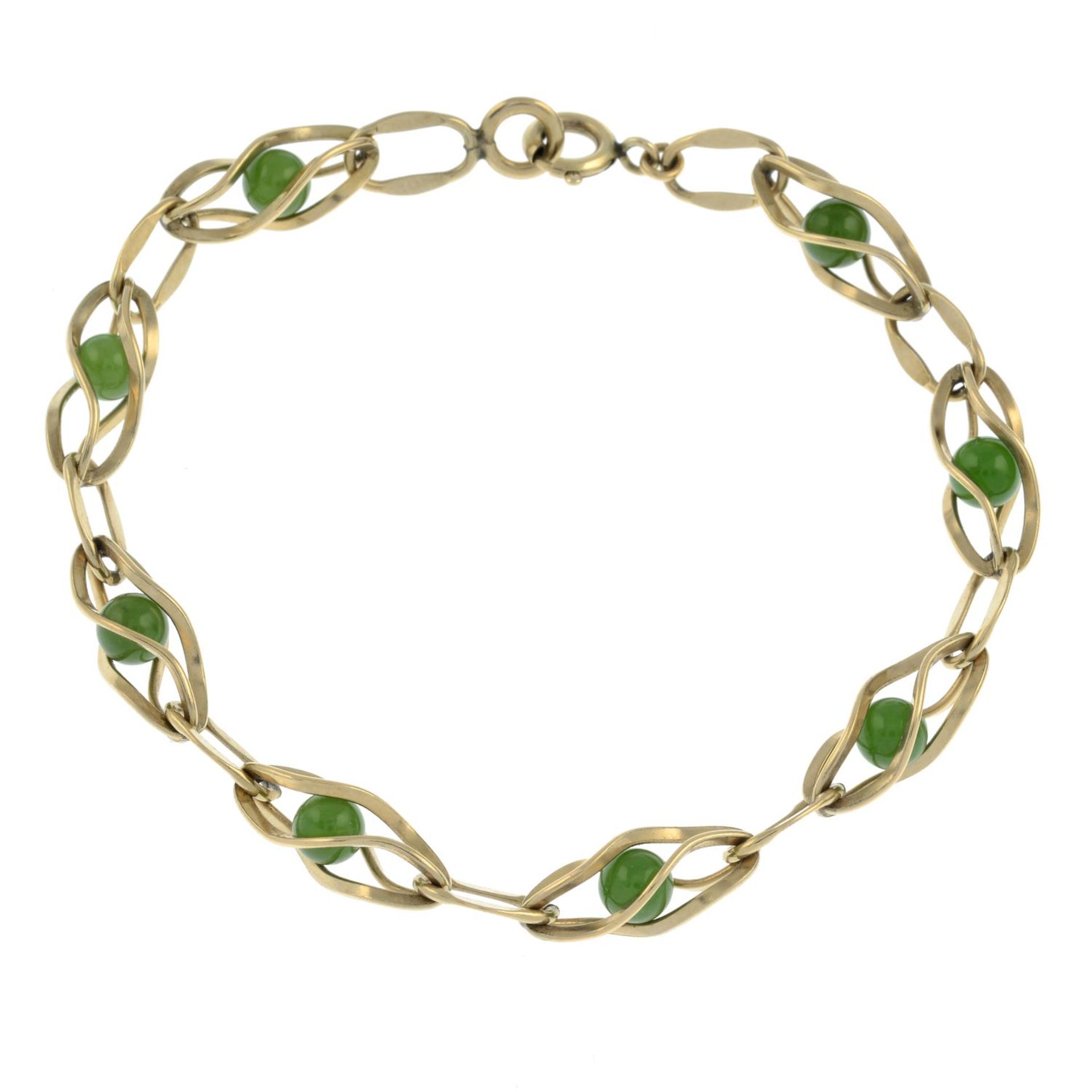 A nephrite bracelet, by Krementz.Signed Krementz.