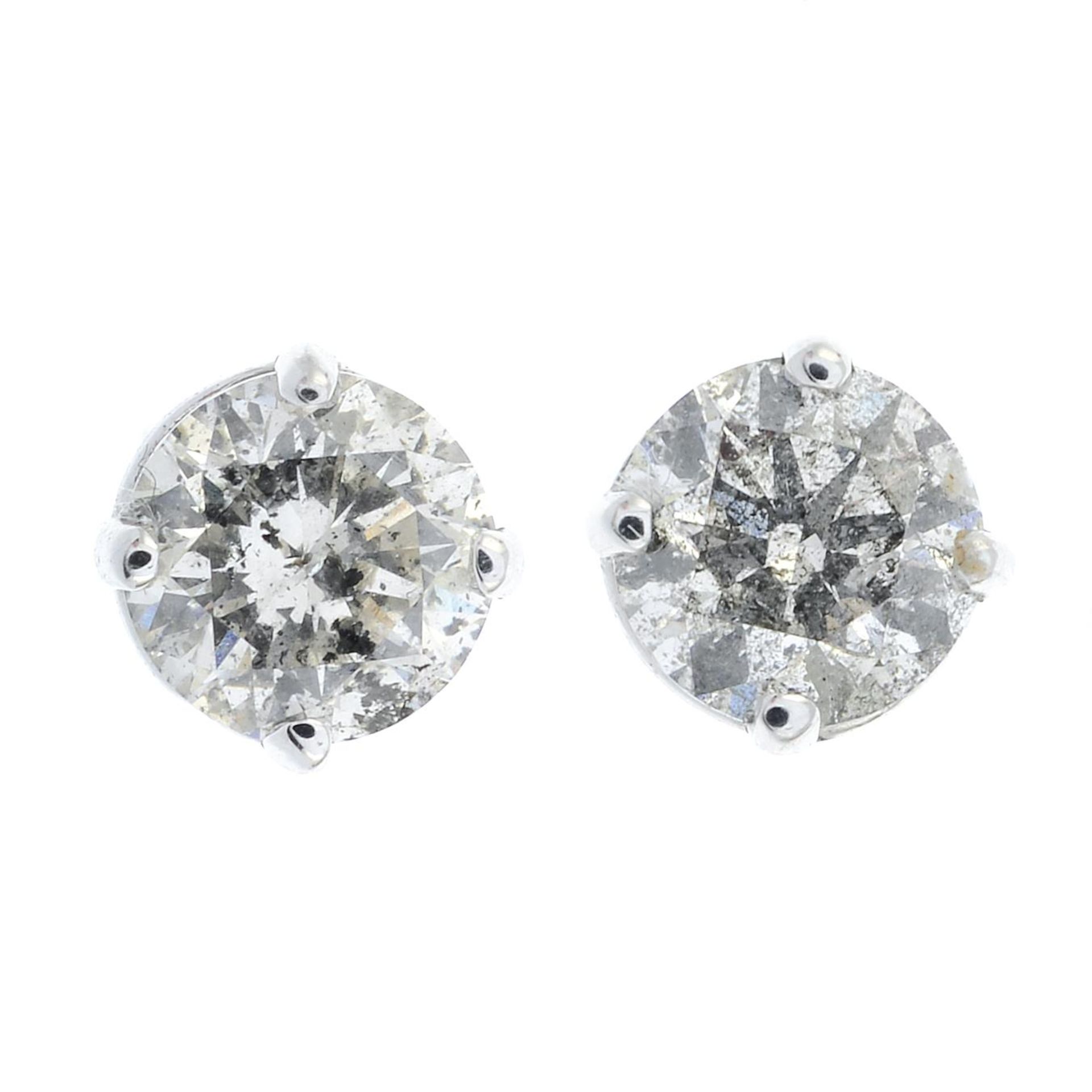 A pair of brilliant-cut diamond stud earrings.Estimated total diamond weight 1ct,