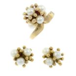 A 9ct gold cultured pearl ring designed as a stylised flower and a pair of matching stud earrings.