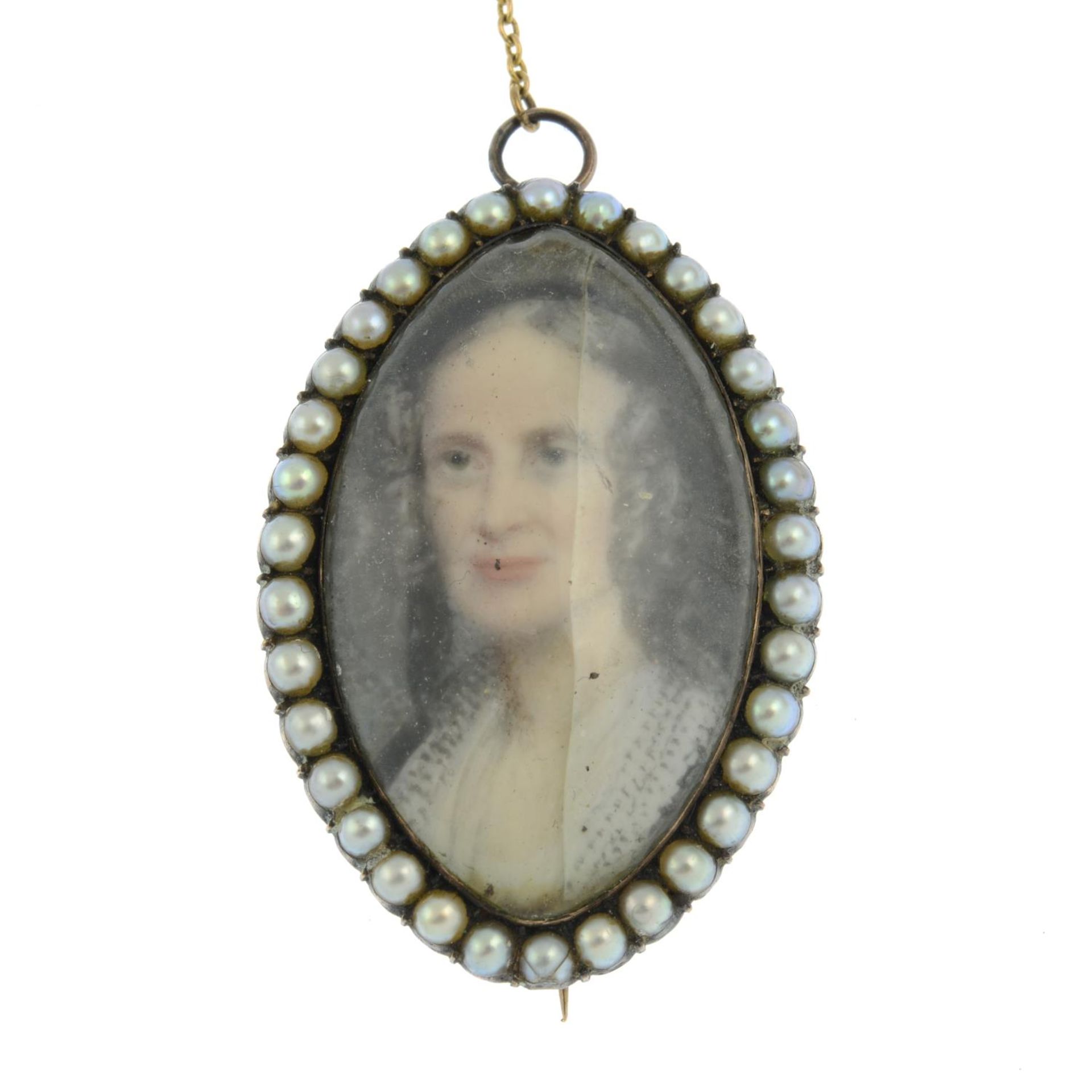 A 19th century split pearl and ivory portrait miniature brooch, painted to depict a lady.