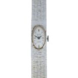 A lady's 1970s 9ct gold wristwatch.Hallmarks for London, 1975.Length 17cms.