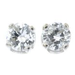 A pair of 18ct gold diamond stud earrings.Estimated total diamond weight 0.30ct,