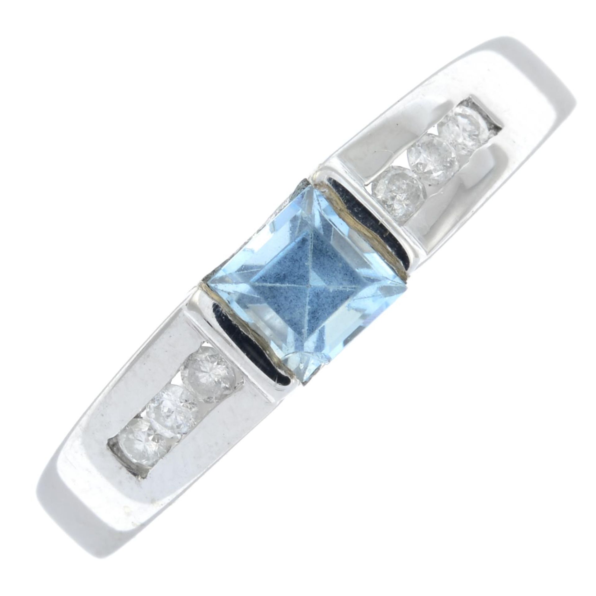 A 9ct gold diamond and blue gem ring.Estimated total diamond weight 0.10ct.