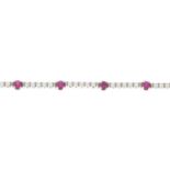 A ruby and cubic zirconia bracelet.Stamped 750.