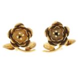 A pair of floral earrings, each designed to depict a rose.Stamped 14K.