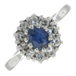 A sapphire and diamond cluster ring.Estimated total diamond weight 0.30ct.