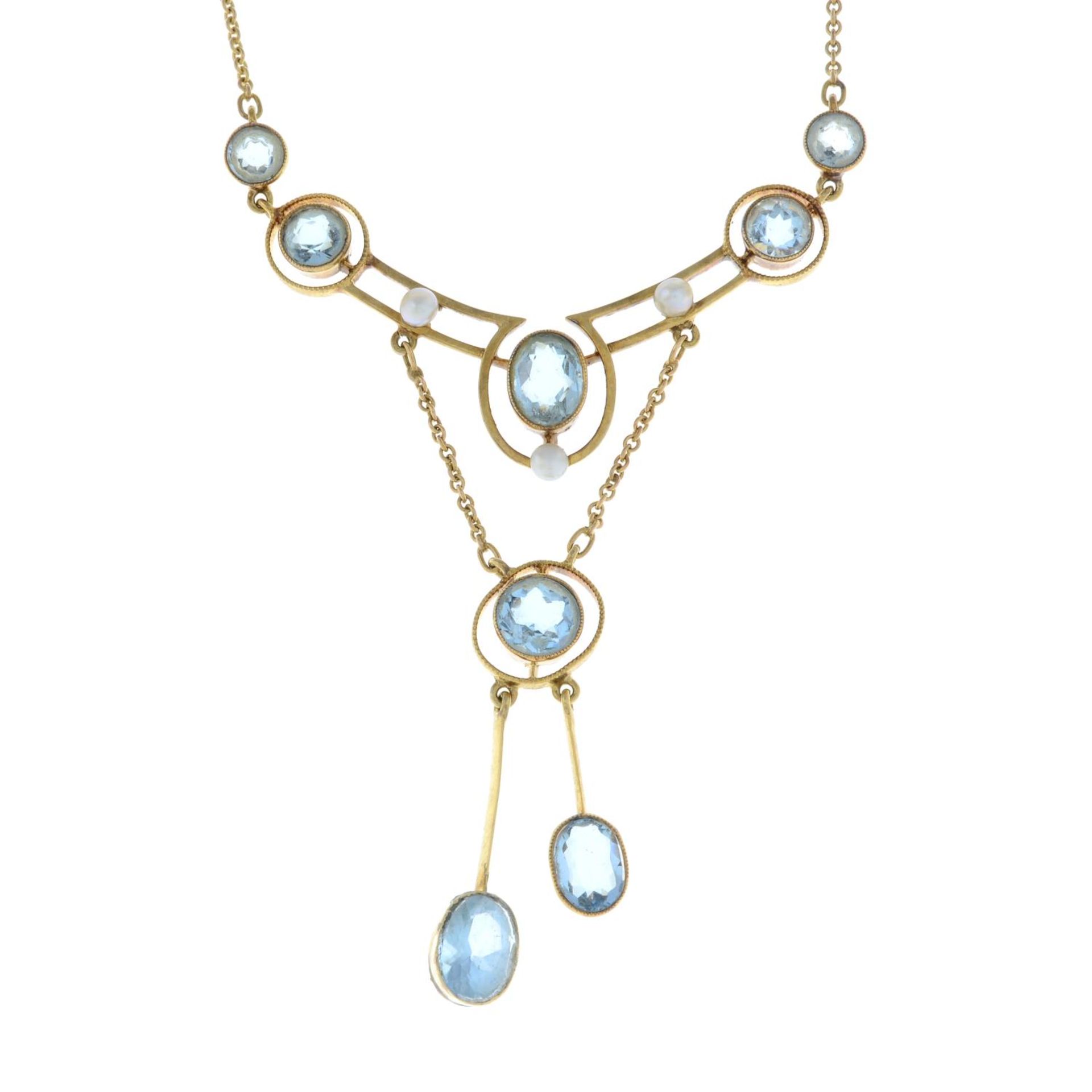 An early 20th century 15ct gold aquamarine and seed pearl drop négligée necklace, by Cropp & Farr.