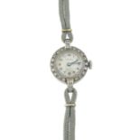 A lady's mid 20th century platinum and 9ct gold single-cut diamond cocktail wristwatch,