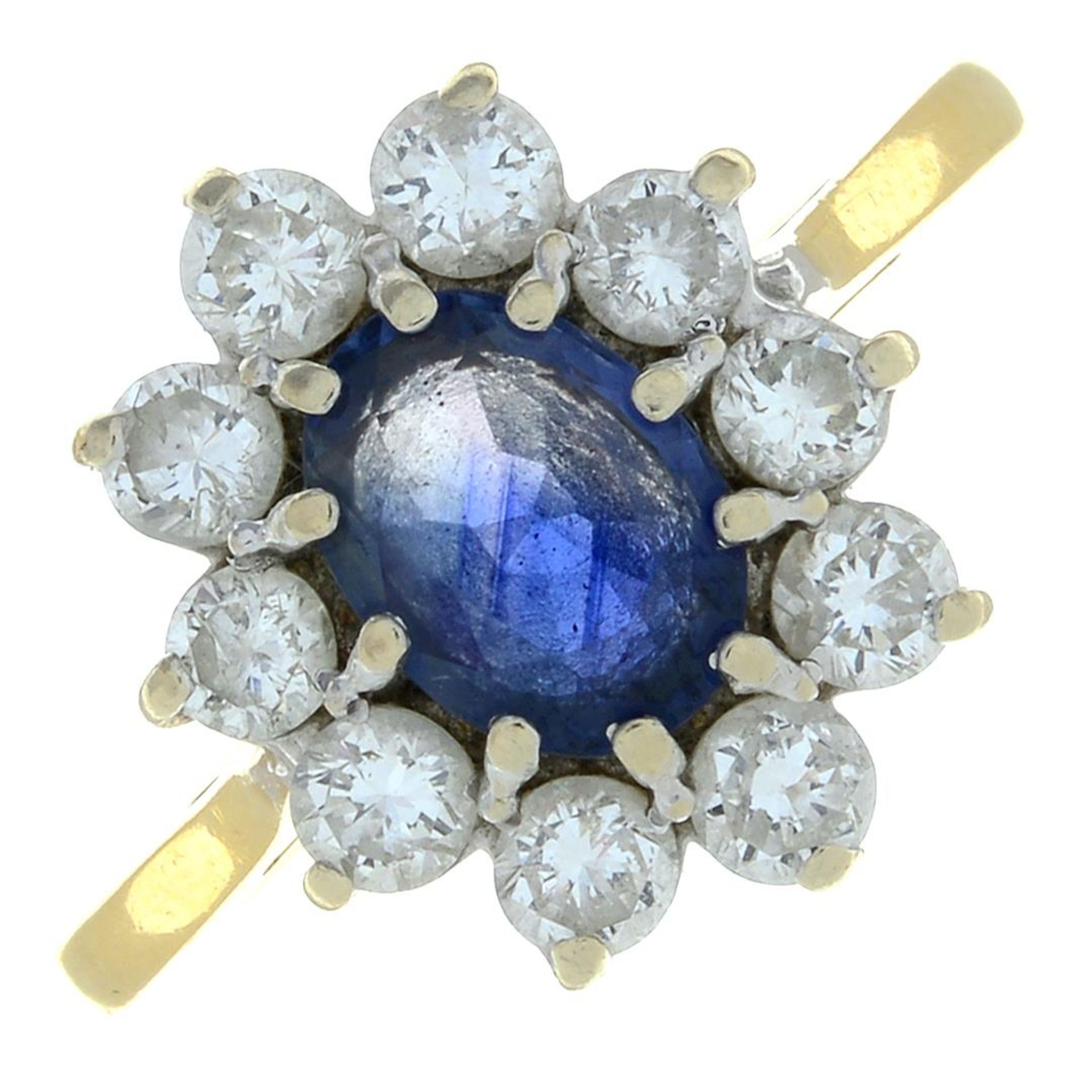 An 18ct gold sapphire and brilliant-cut diamond cluster ring.Estimated total diamond weight 0.80ct,