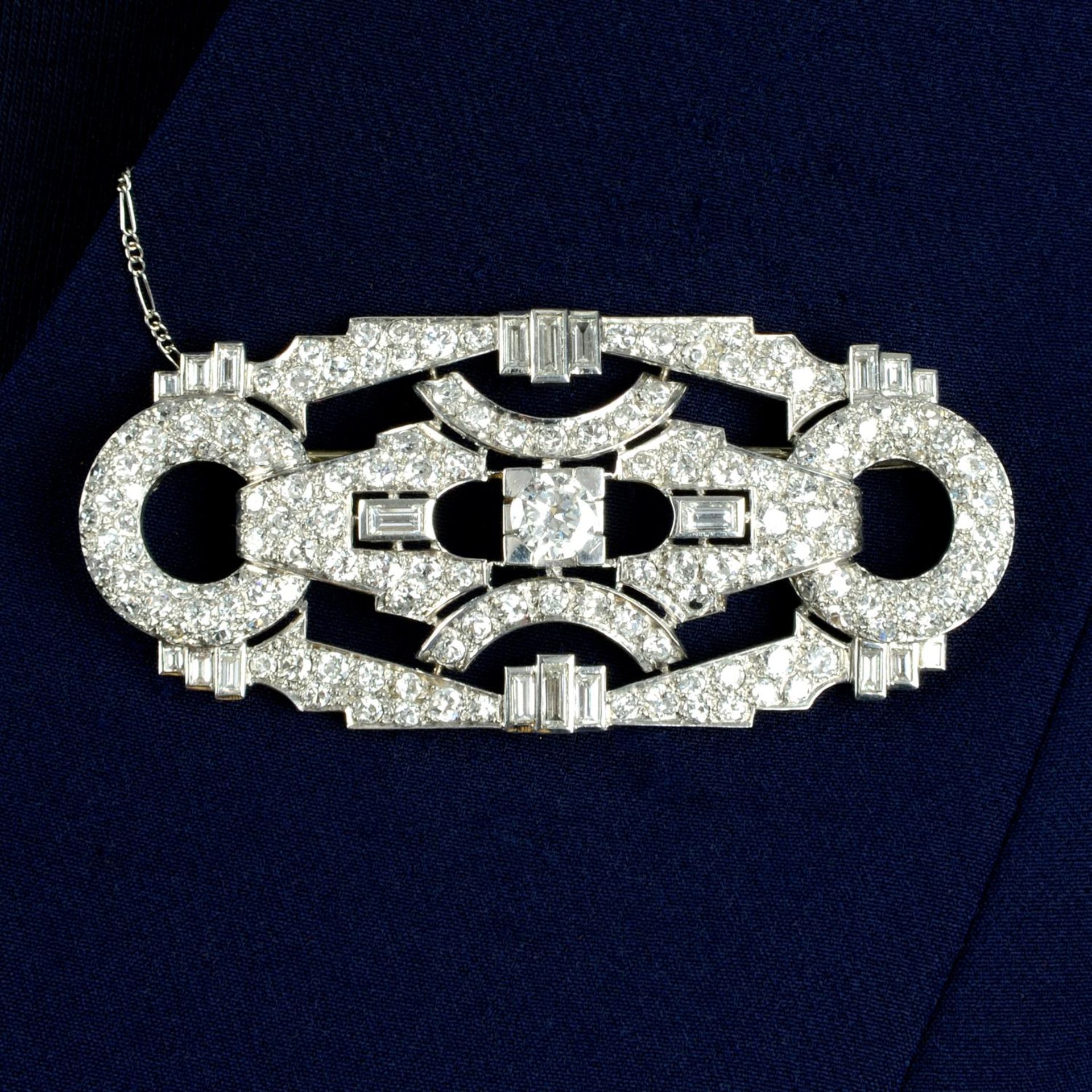 A mid 20th century platinum and gold diamond geometric brooch.Principal diamond estimated weight