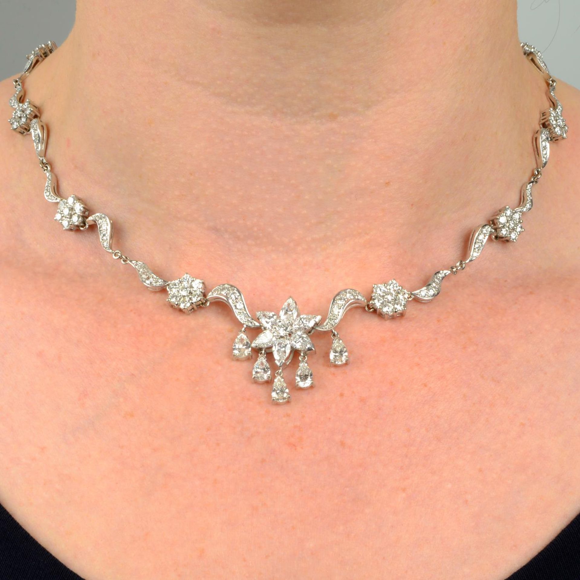 An 18ct gold vari-cut diamond floral necklace.Estimated total diamond weight 8.50 to 9cts,