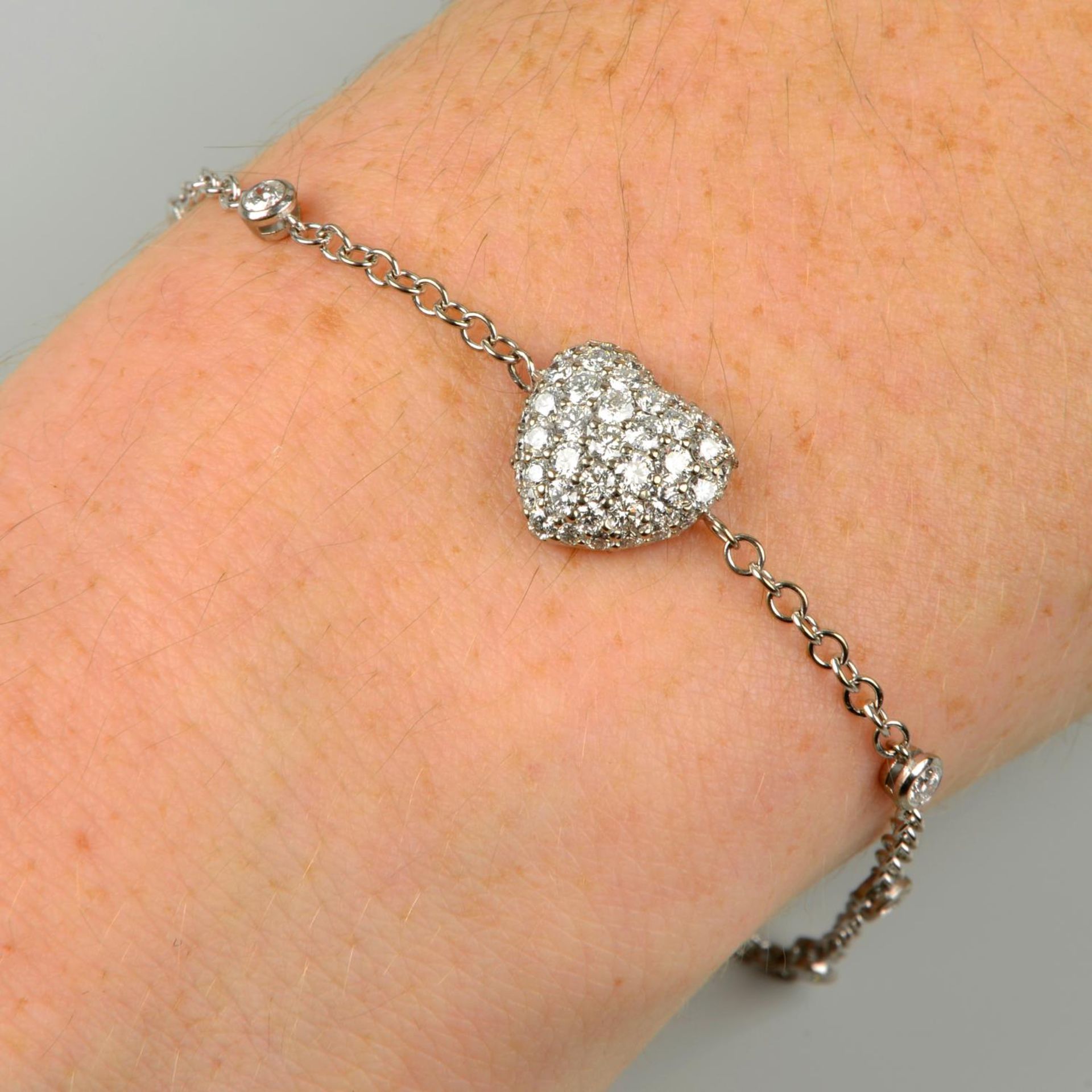 A pavé-set diamond heart bracelet,