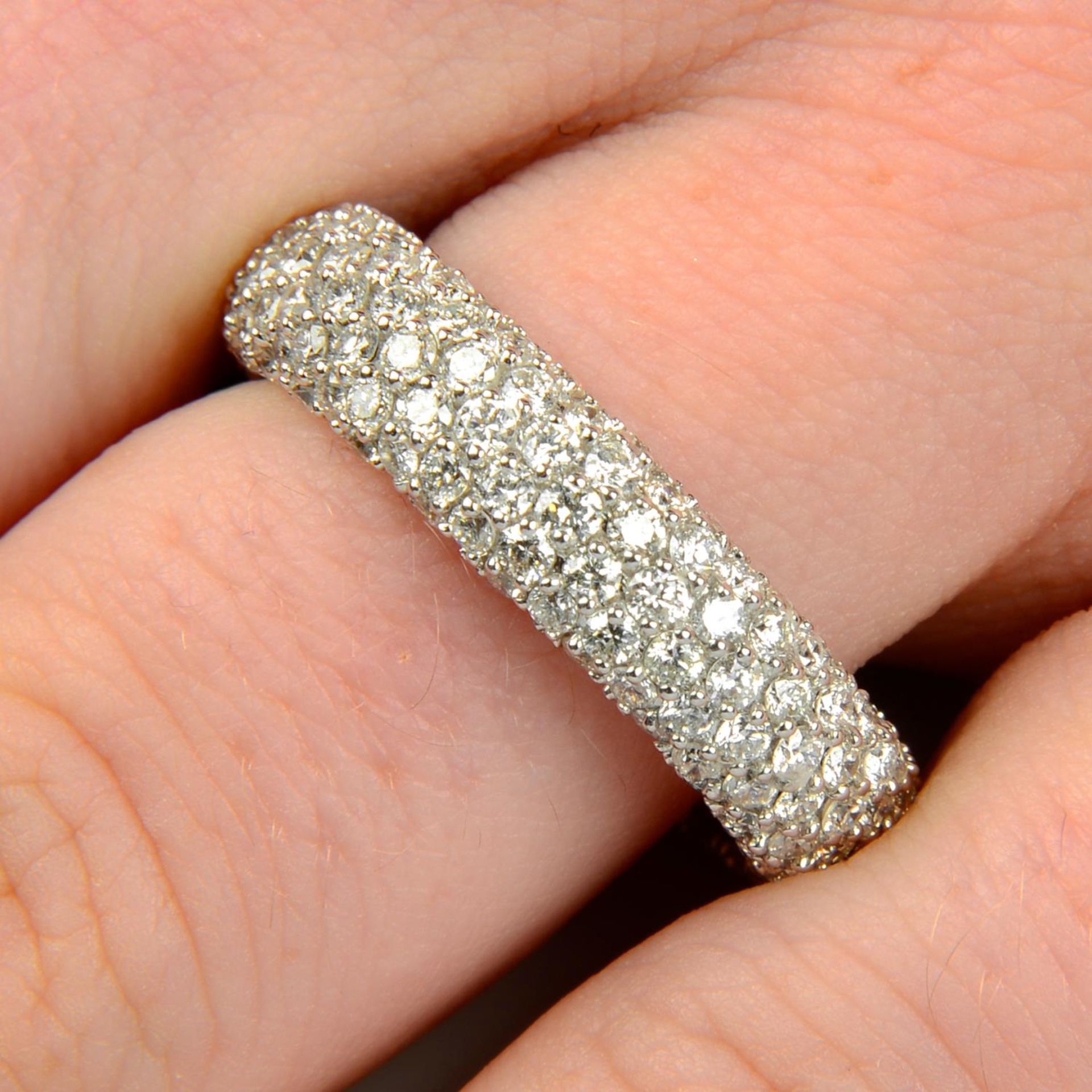 An 18ct gold pavé-set diamond eternity ring.Total diamond weight 3.05cts,