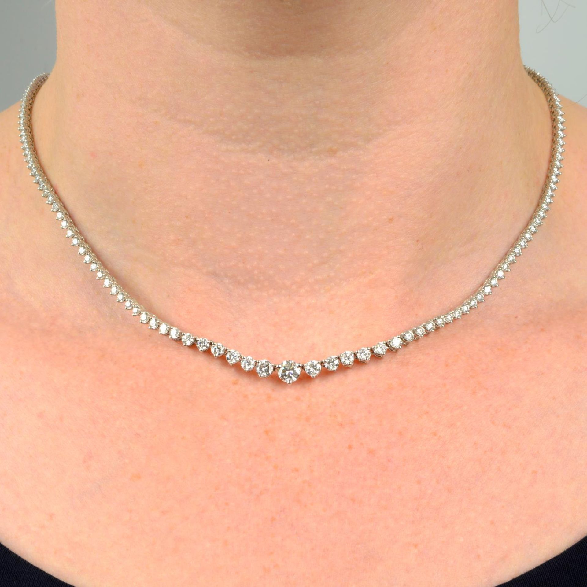 A graduated brilliant-cut diamond line necklace.