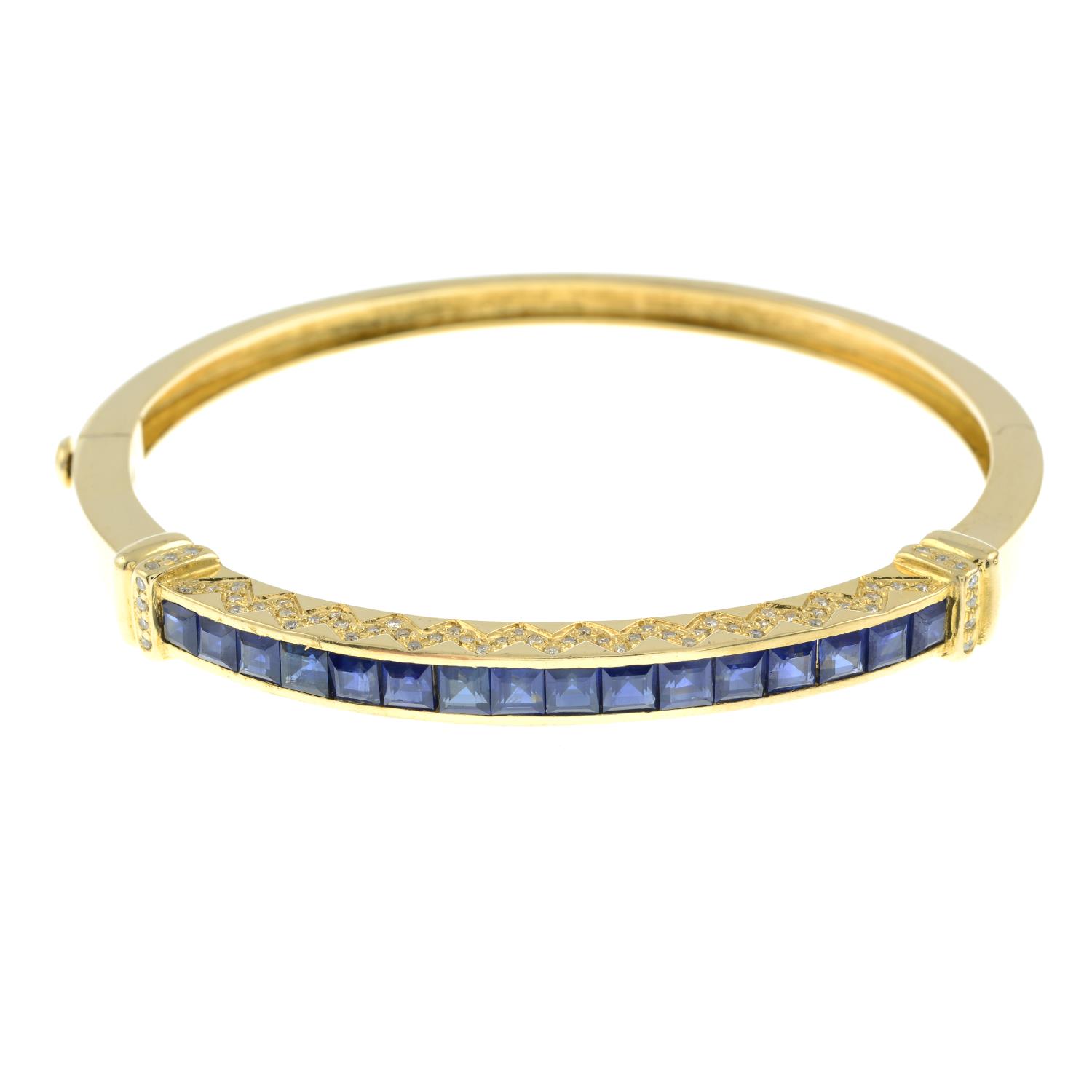A sapphire and brilliant-cut diamond hinged bangle.Estimated total diamond weight 0.20ct. - Image 2 of 4
