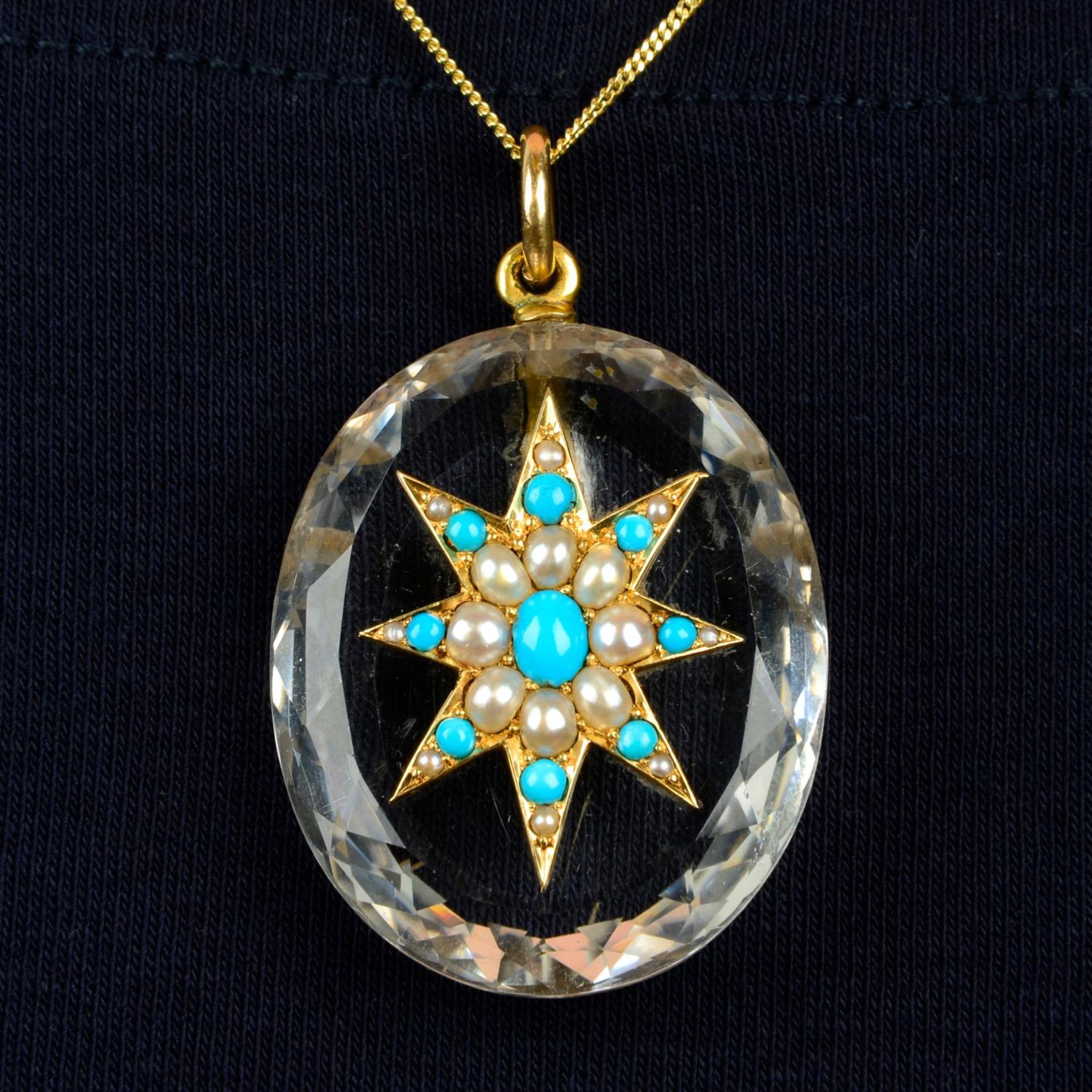 A Victorian 15ct gold rock crystal, turquoise and split pearl star pendant.Length 4.7cms.