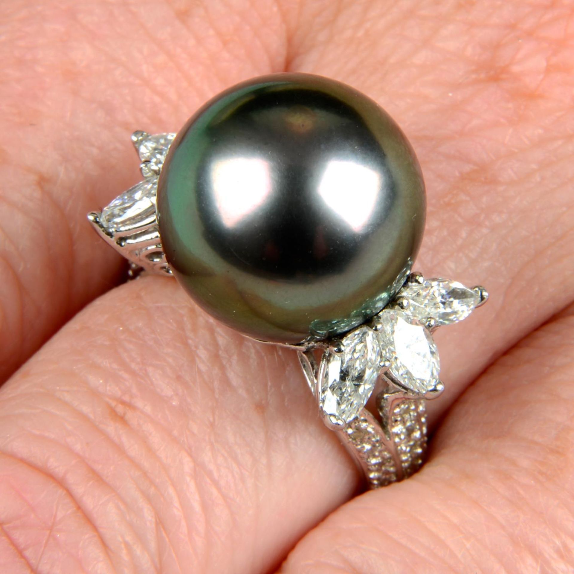 A 'Tahitian' cultured pearl and diamond cocktail ring.Estimated total diamond weight 0.90ct,