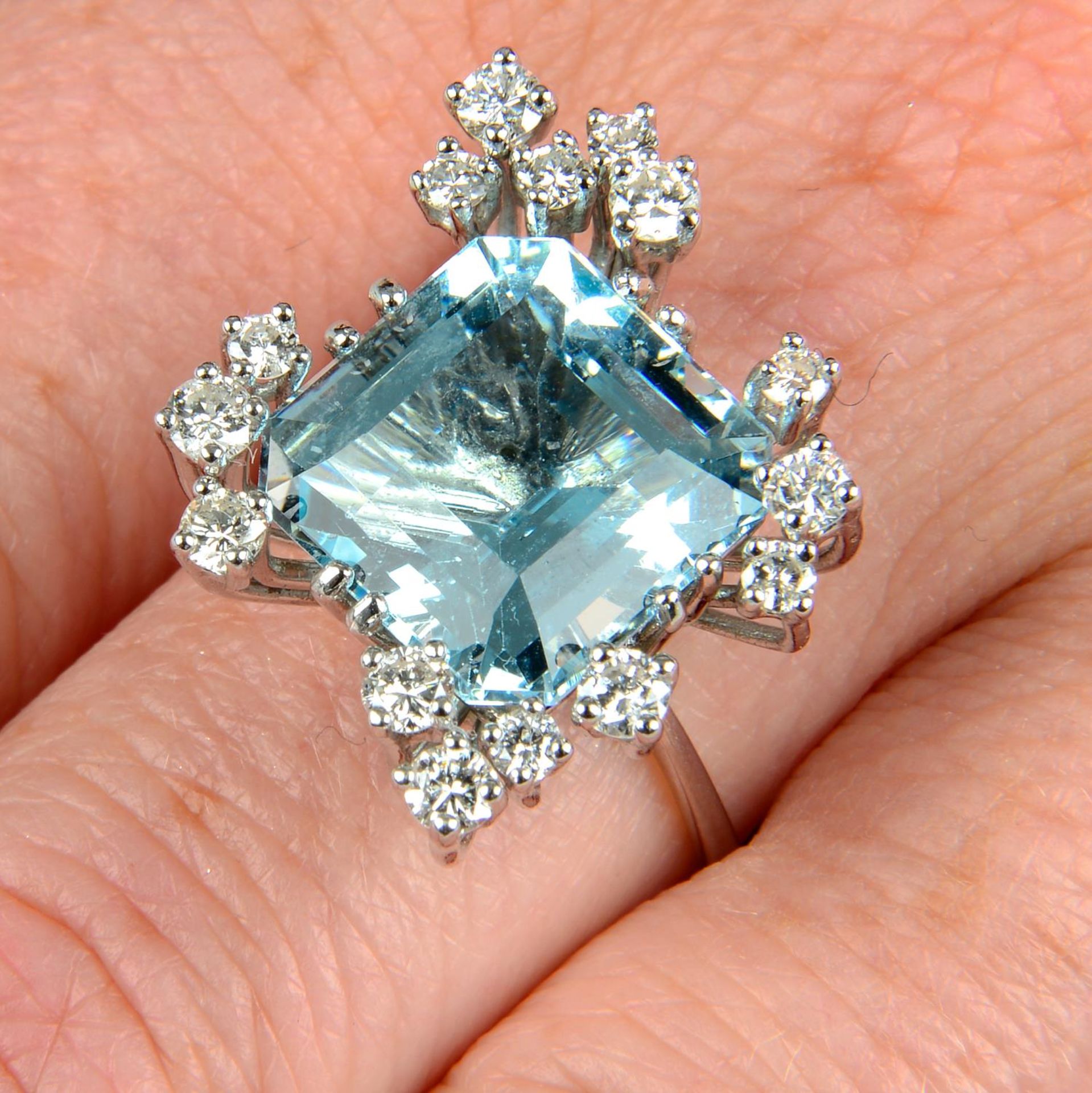 A 1970s 18ct gold aquamarine and diamond cocktail ring.Aquamarine calculated weight 7.20cts,