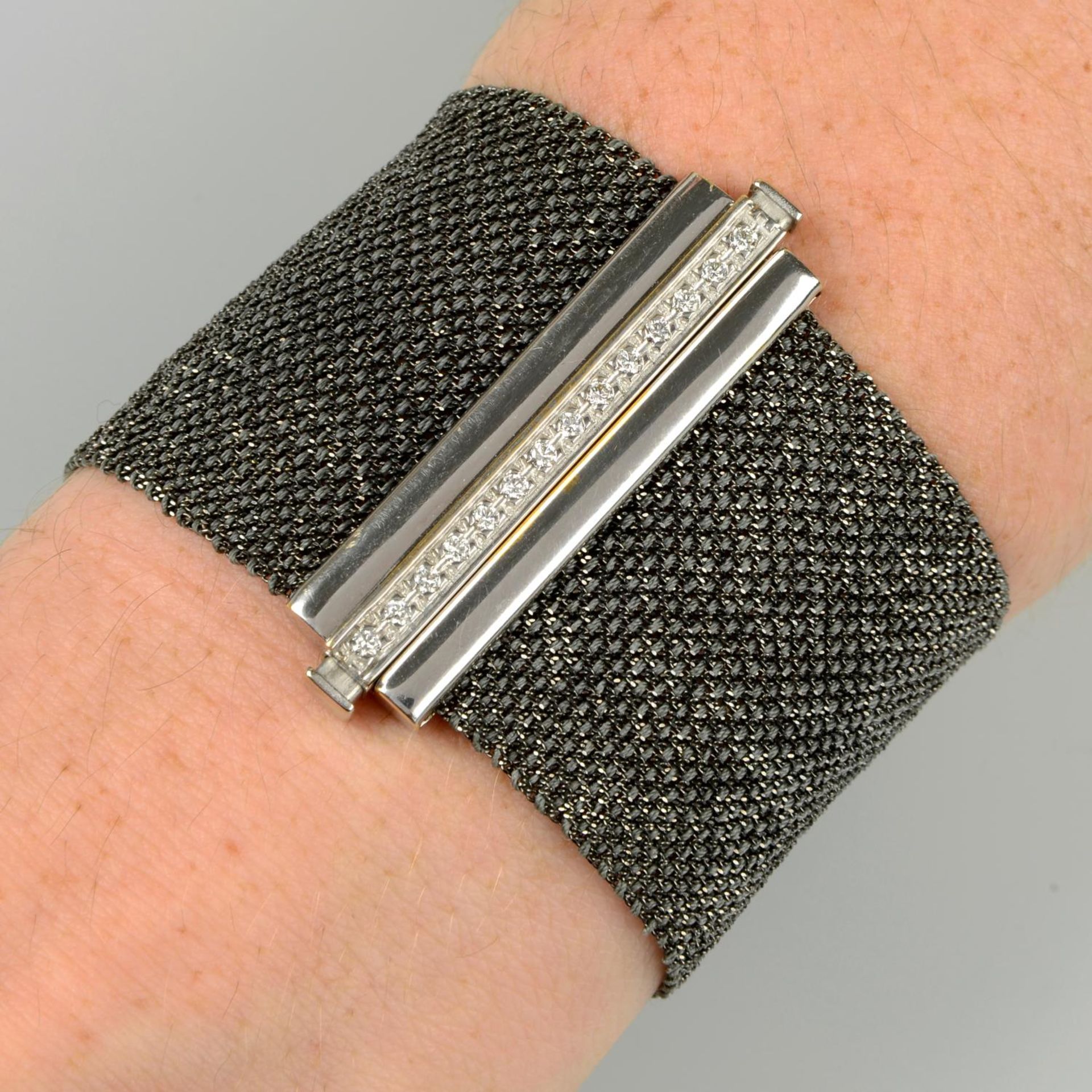 A woven bracelet, with pavé-set diamond clasp, by Carolina Bucci.