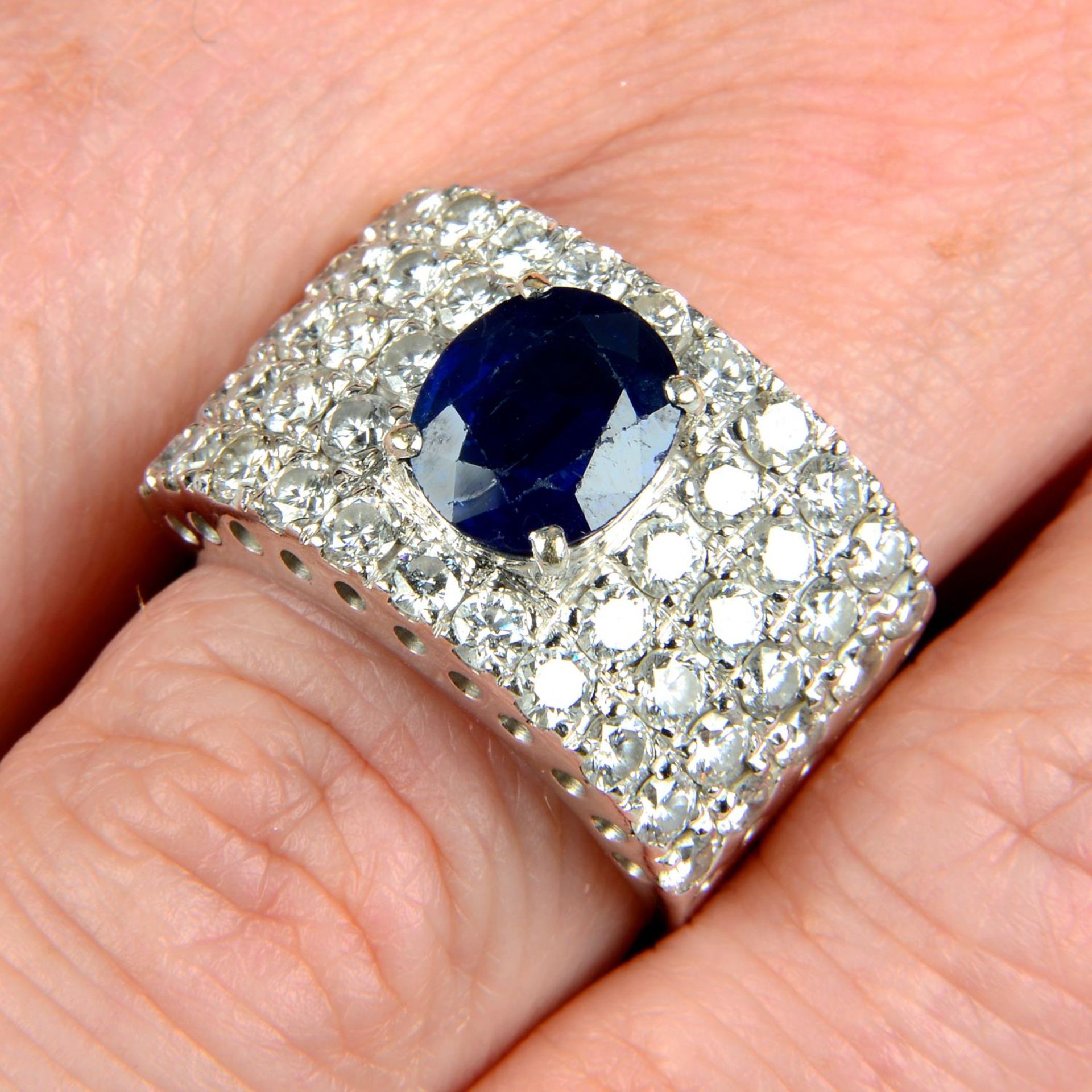 A sapphire and diamond dress ring.Sapphire calculated weight 1.90cts,