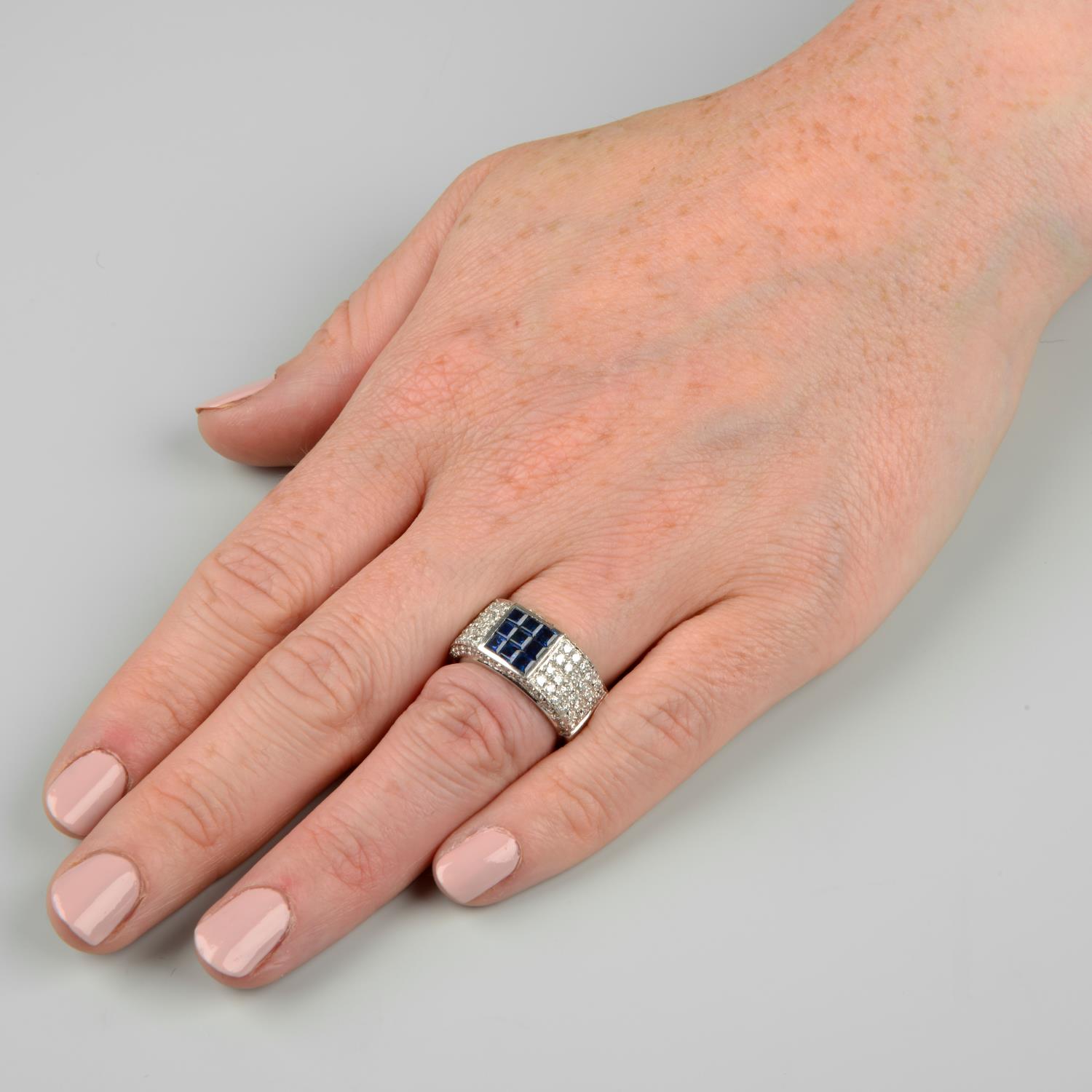 A calibré-cut sapphire and pavé-set diamond band ring.Estimated total diamond weight 1.25cts, - Image 3 of 6