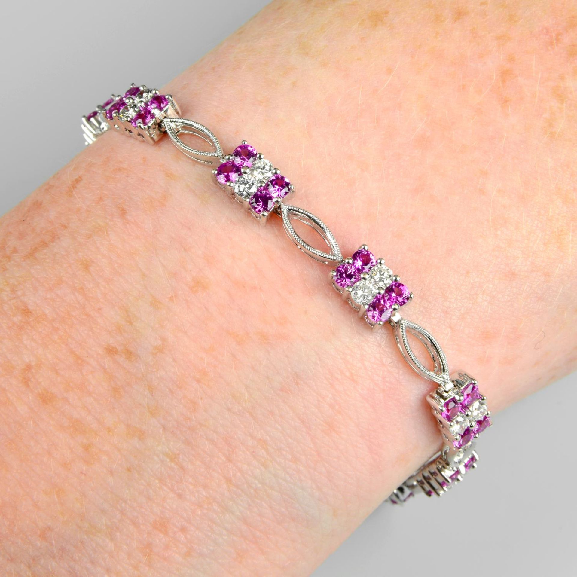 A pink sapphire and diamond bracelet.