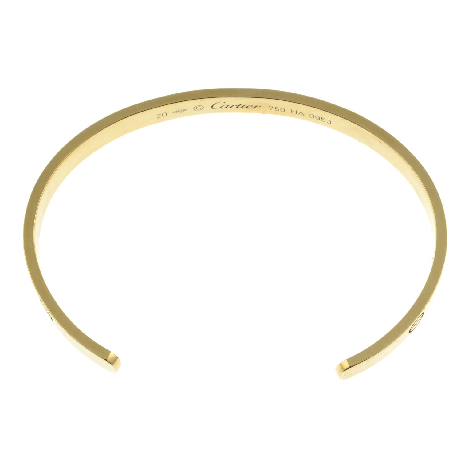 A 'Love' bangle cuff, by Cartier.Stamped 750. - Image 4 of 4