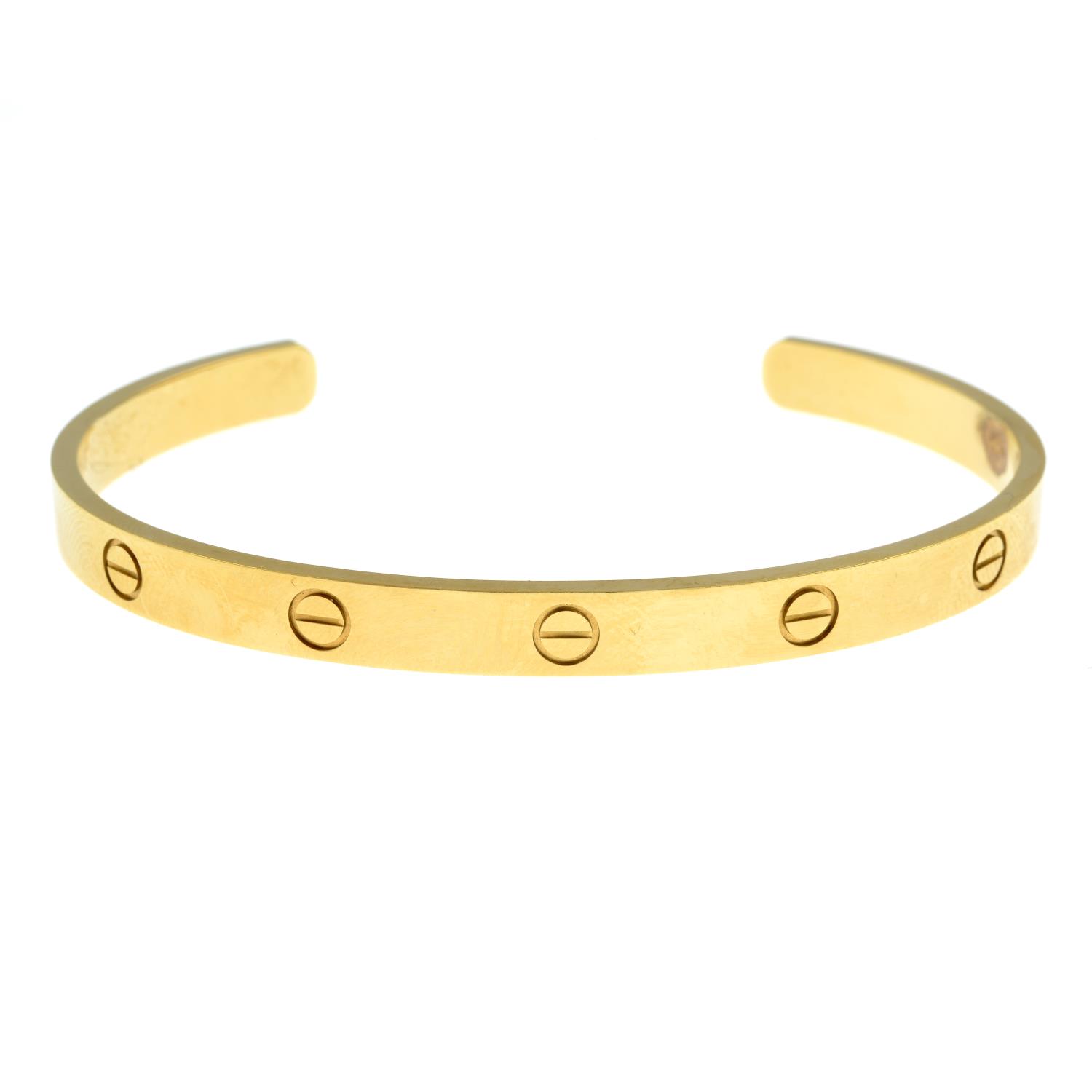 A 'Love' bangle cuff, by Cartier.Stamped 750. - Image 2 of 4