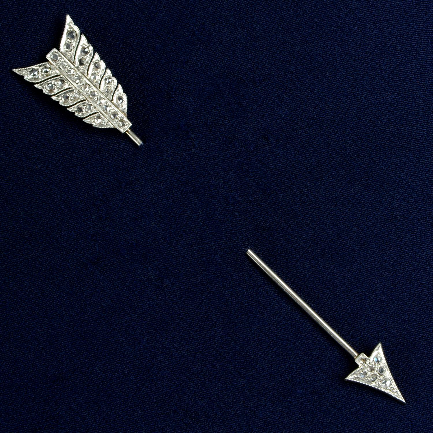 An early 20th century platinum and gold, rose-cut diamond arrow jabot pin.Length 7.6cms.