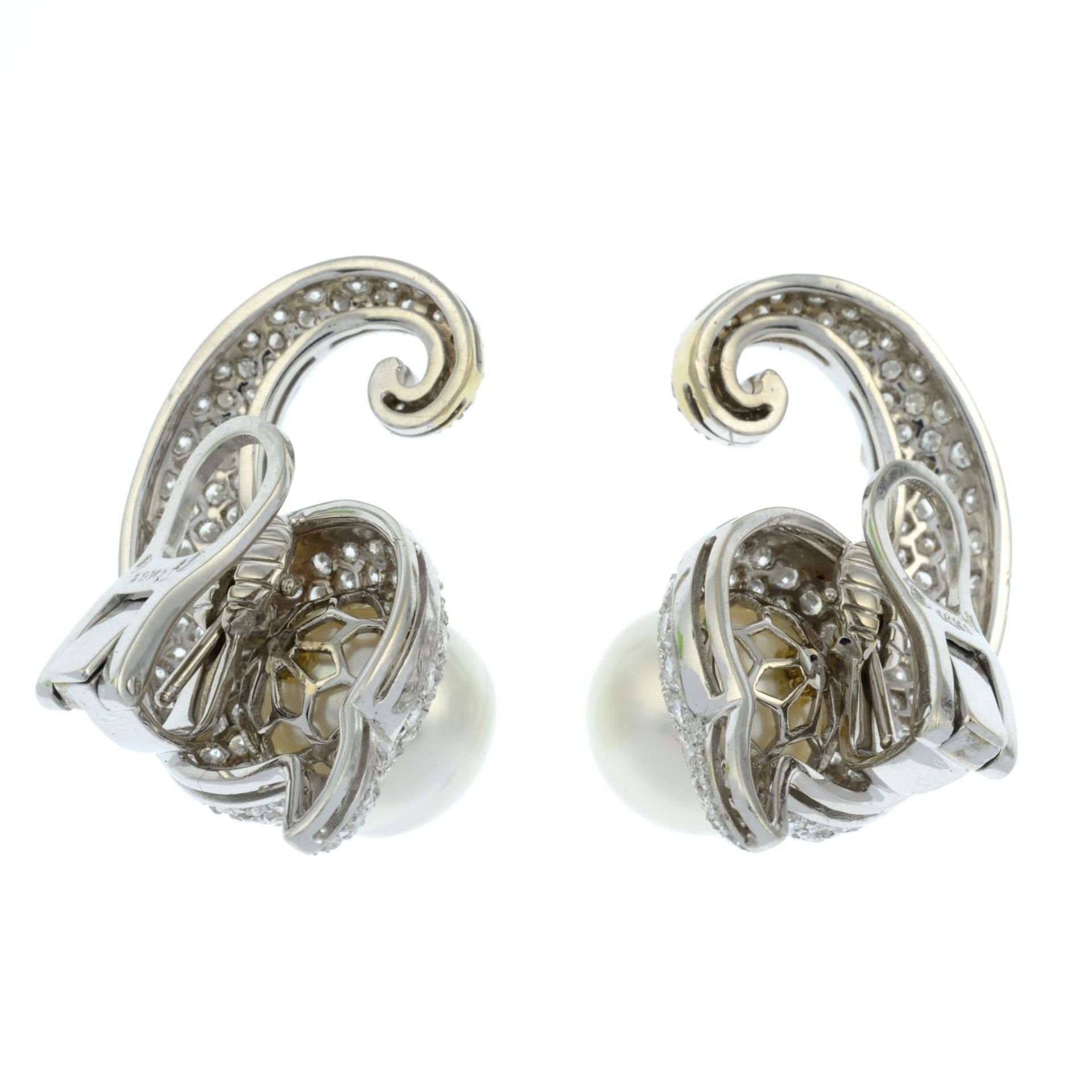 A pair of cultured pearl and pavé-set diamond scroll earrings.Estimated total diamond weight 4cts, - Bild 3 aus 3