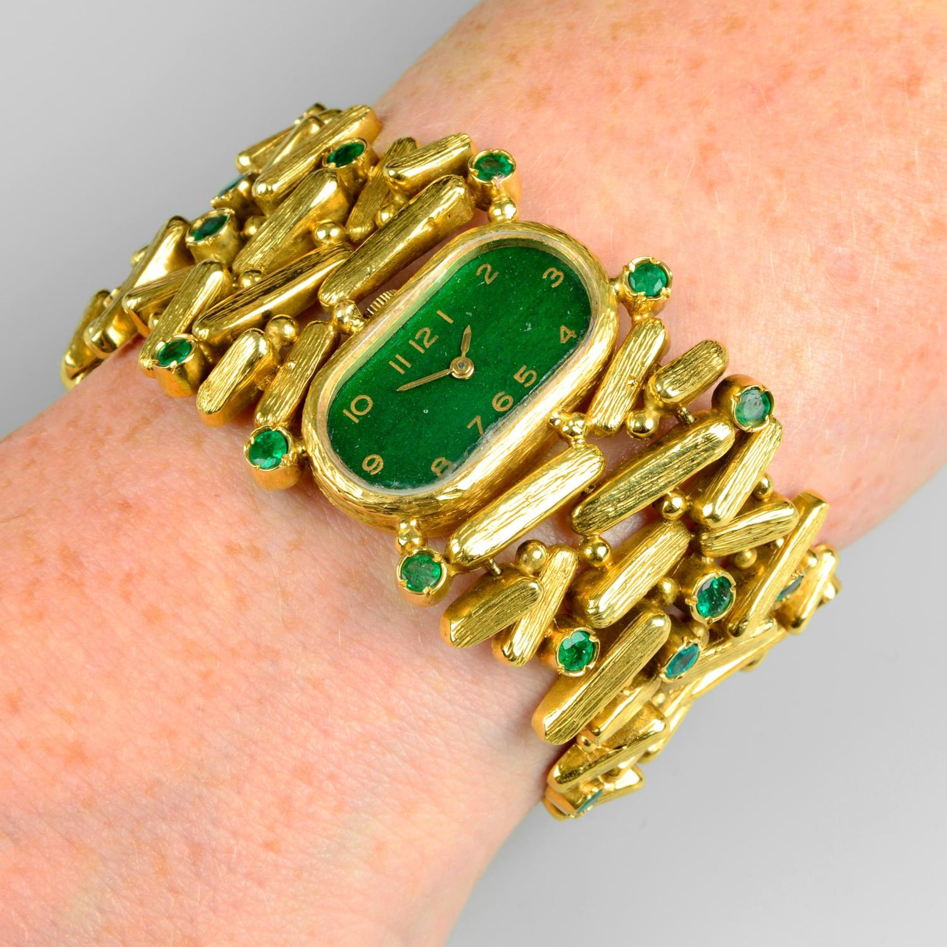 A 1970s 18ct gold emerald cocktail watch, with painted green dial.Maker's mark PG.