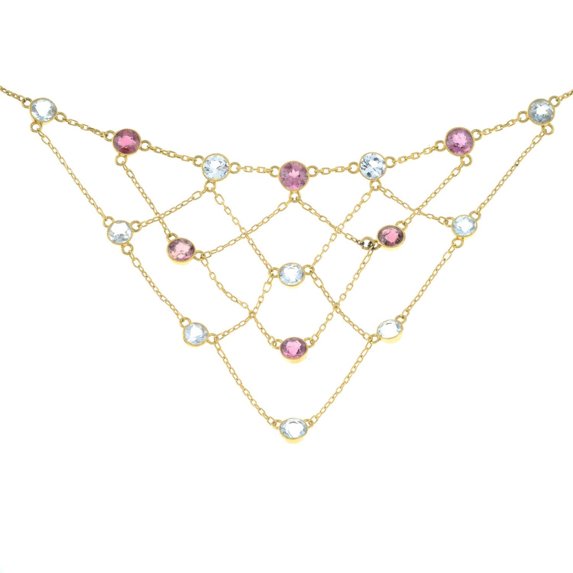 An early 20th century 18ct gold pink tourmaline and aquamarine lattice necklace.Stamped 18. - Image 2 of 5