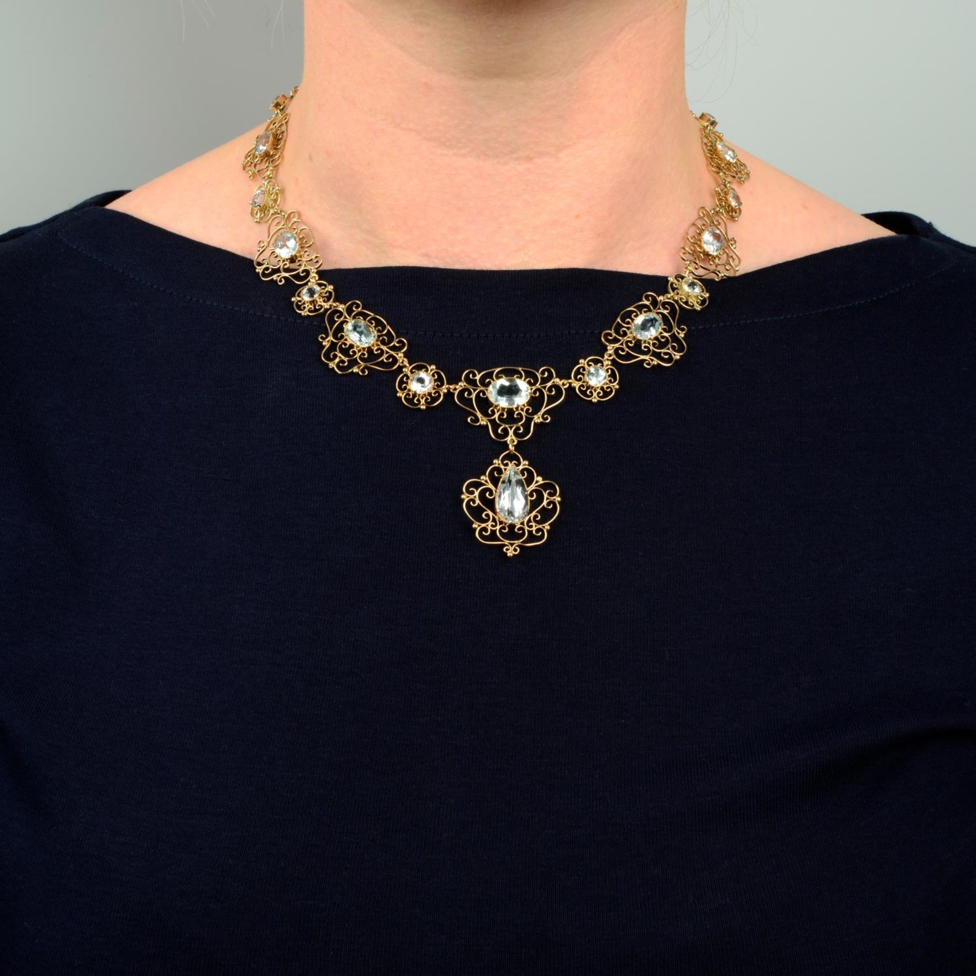 An early 20th century Arts & Crafts gold aquamarine necklace.Length 43.5cms. - Image 3 of 6
