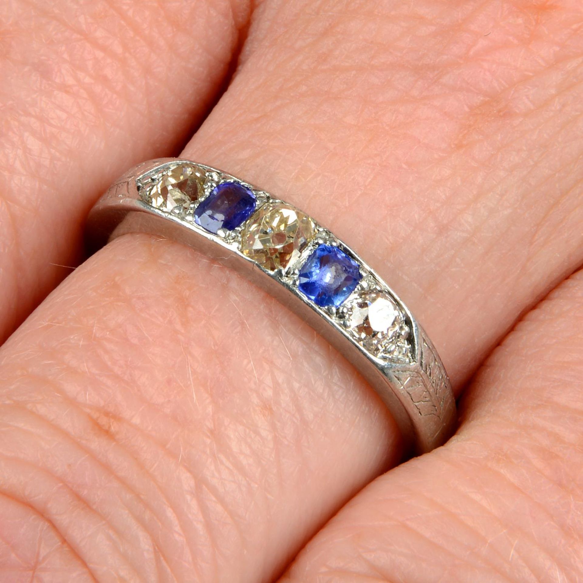 An early 20th century platinum sapphire and old-cut diamond five-stone ring.