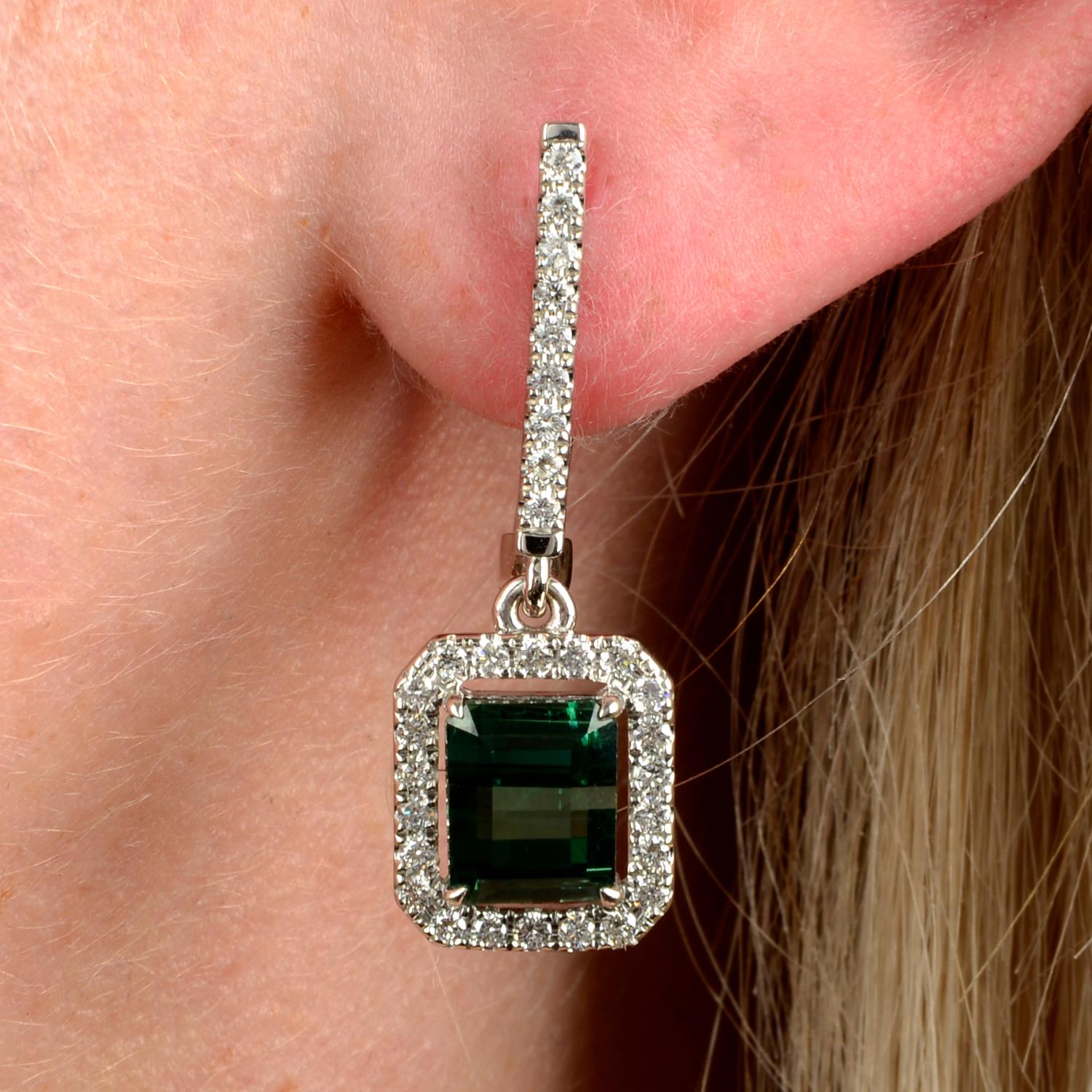 A pair of green tourmaline and diamond drop earrings.Tourmaline calculated total weight 3.91cts,