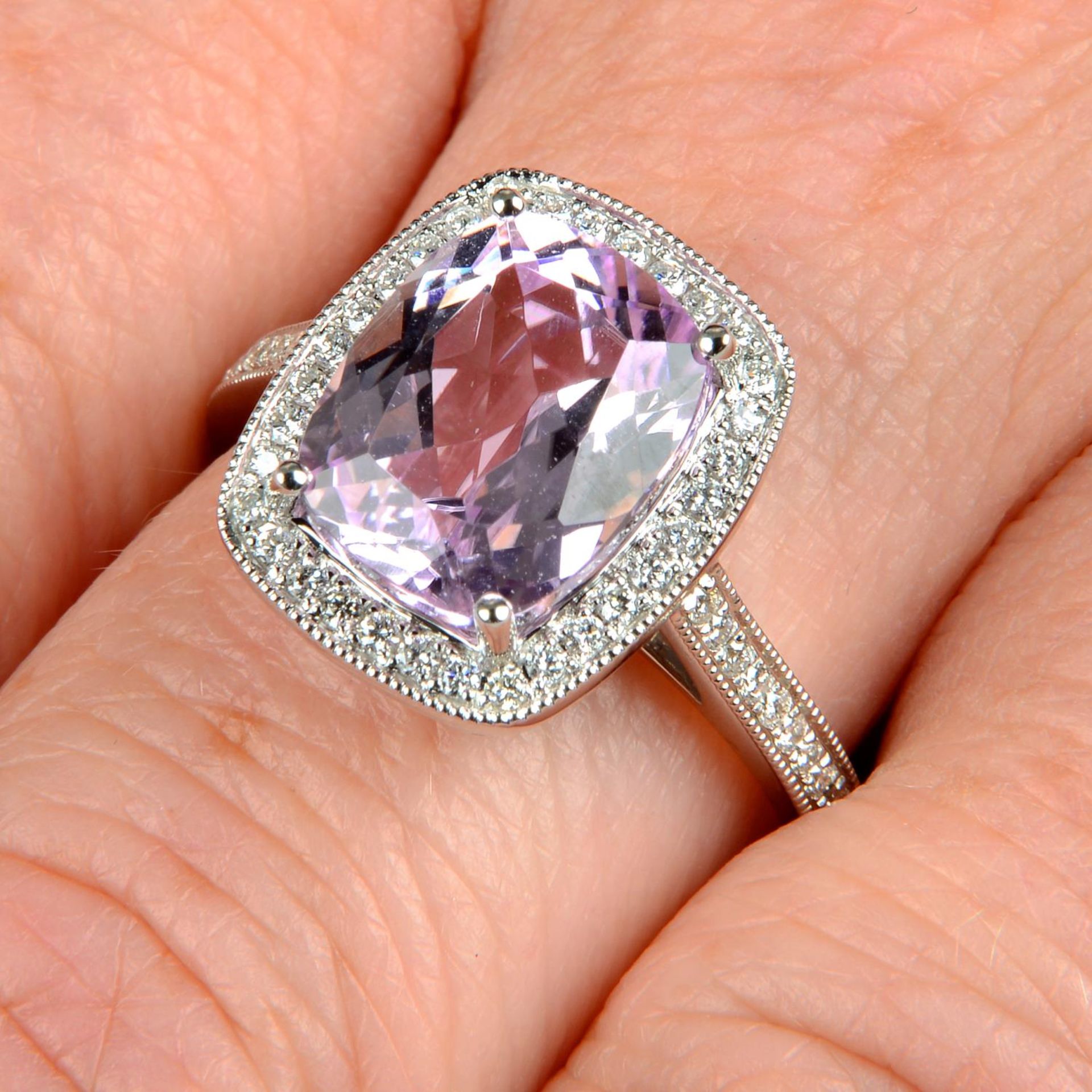 An 18ct gold kunzite and brilliant-cut diamond dress ring.Kunzite weight 3.83cts.