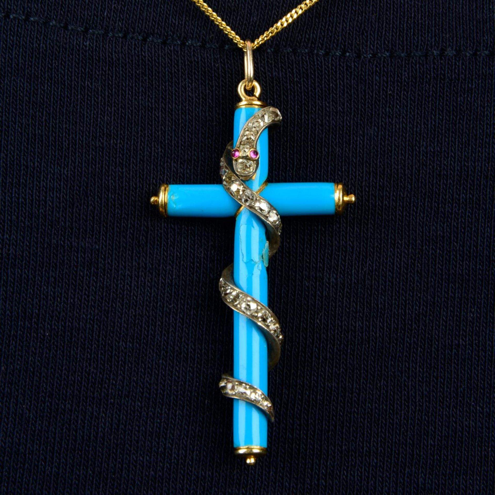 A mid Victorian gold, blue enamel cross pendant with old-cut diamond coiled snake overlay.