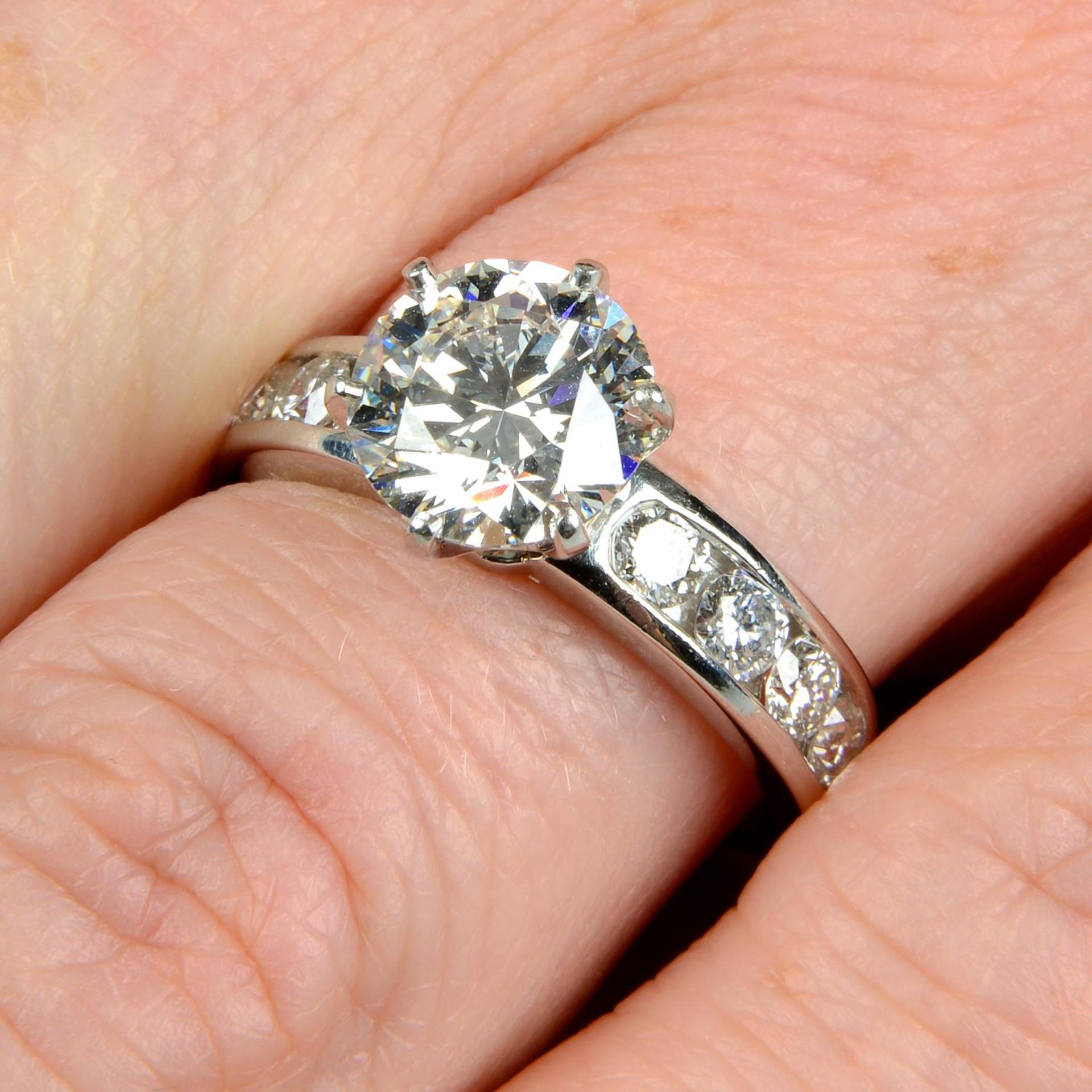 A platinum brilliant-cut diamond single-stone ring,