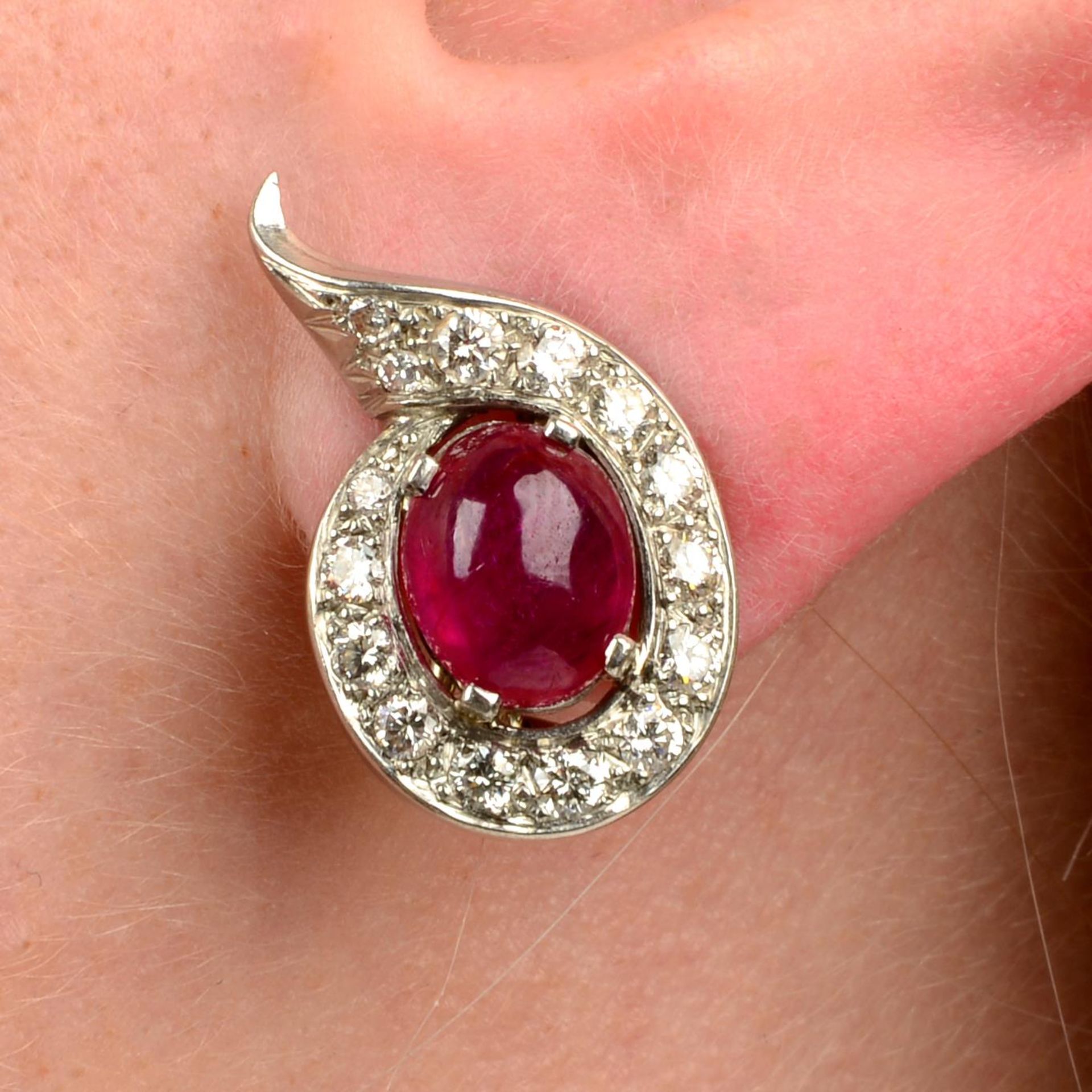 A pair of Burma ruby cabochon and diamond earrings.With report 80246-92,